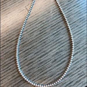 Sterling Silver 3 mm beads strung on steel wire. 18 inches